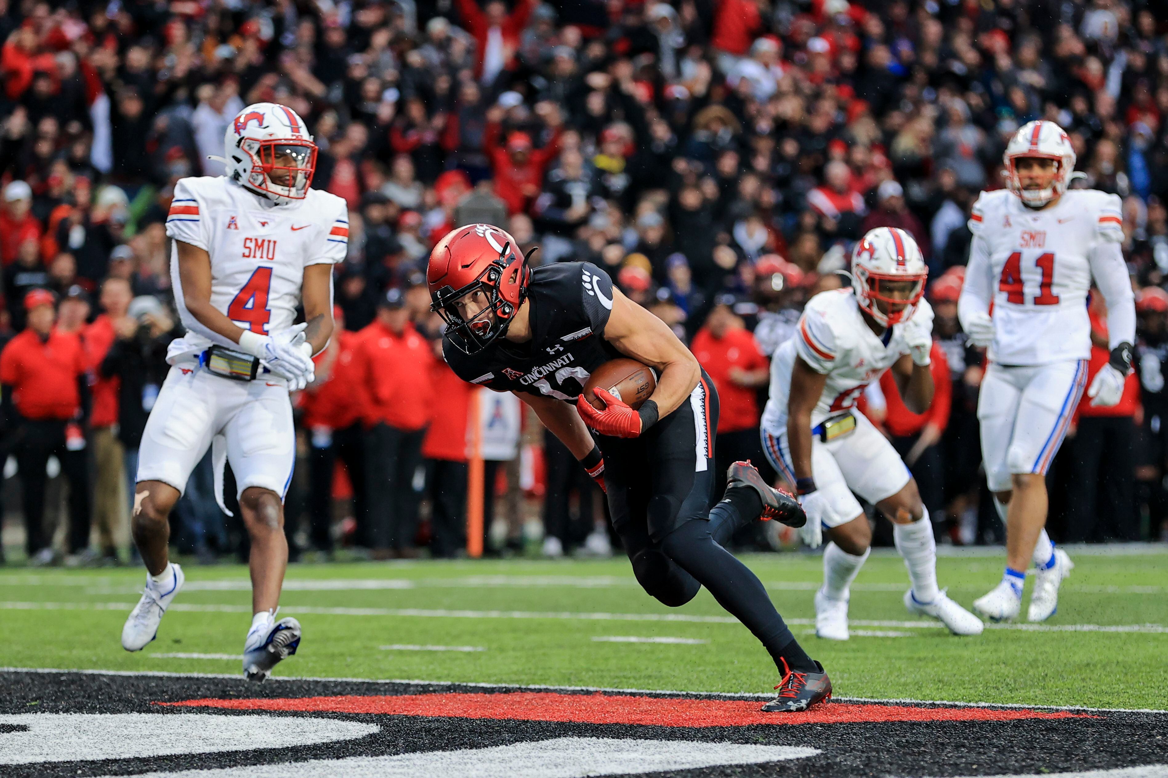 Ridder runs, passes No. 19 Cincinnati past No. 16 SMU, 42-13