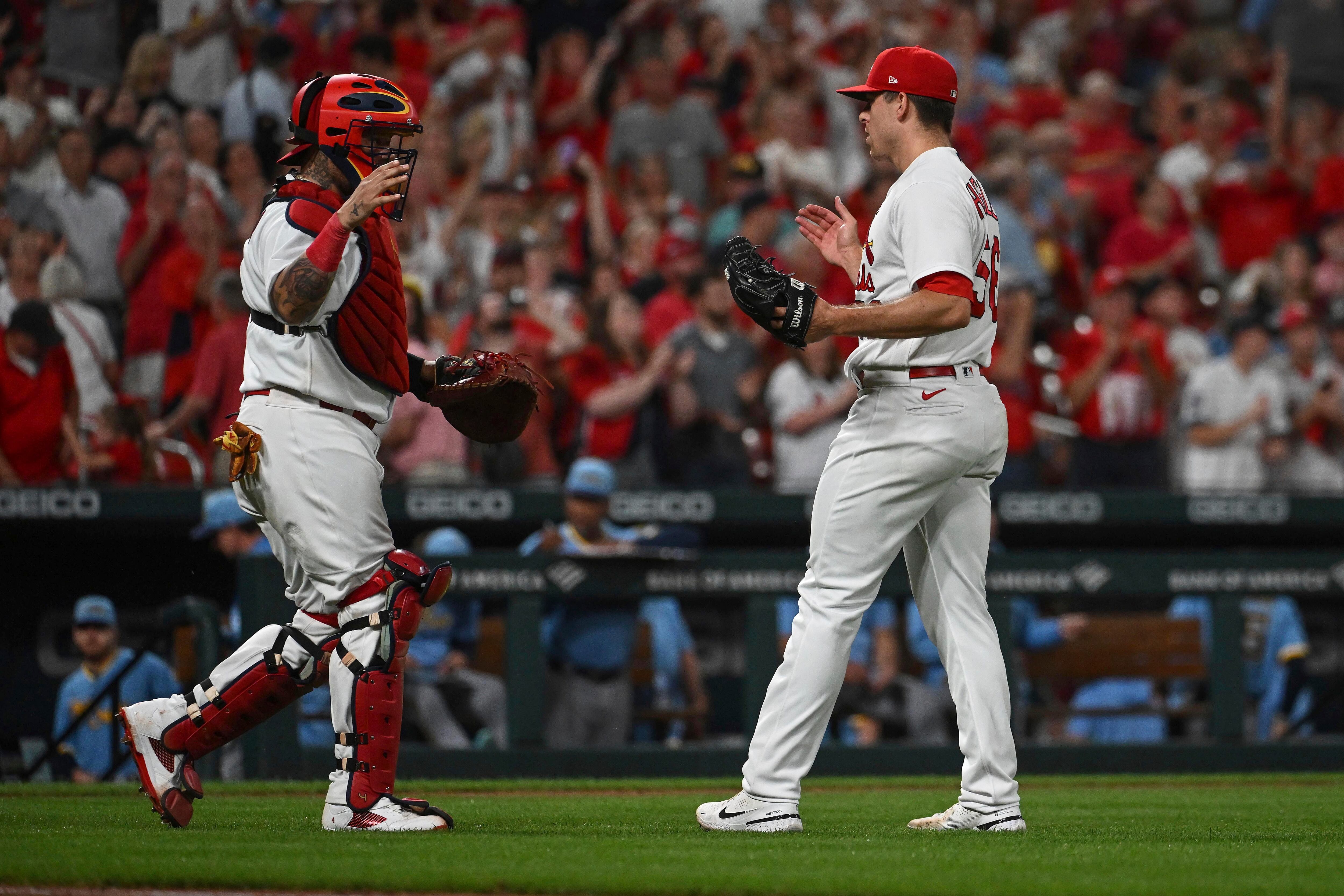 A curve, a keepsake, some Cherry Coke: How Cardinals Wainwright and Molina  made history