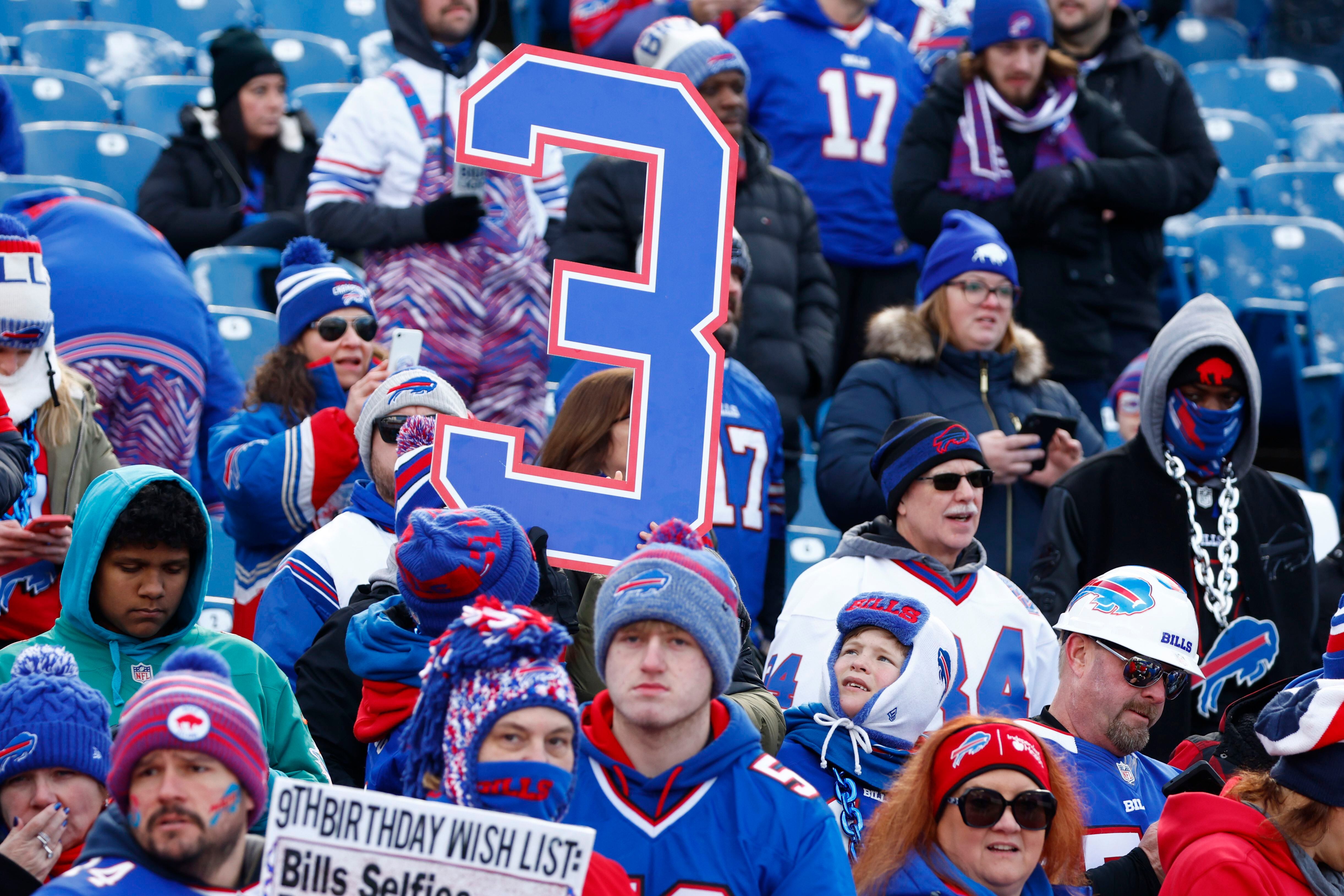 A Buffalo Bills fan cheers from the stands during the second half