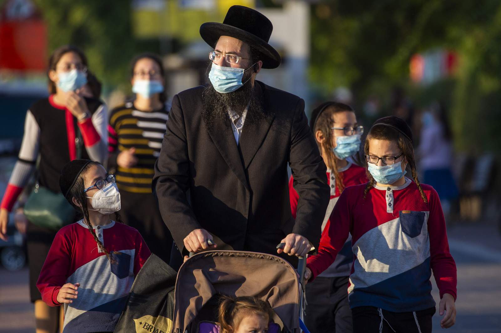 Israel, Palestinians face new restrictions amid virus surge