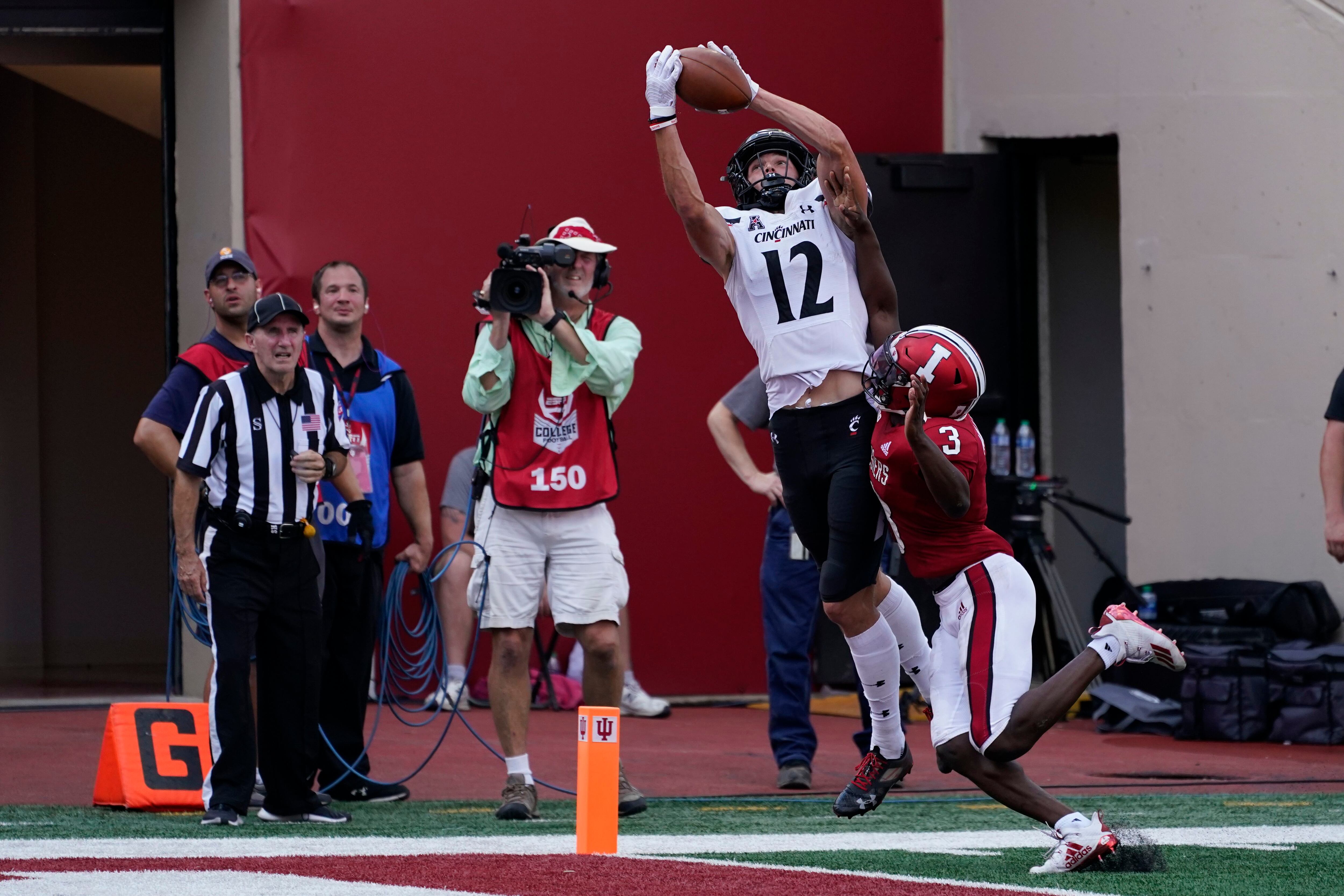 Ridder helps No. 8 Bearcats rally for 38-24 win at Indiana