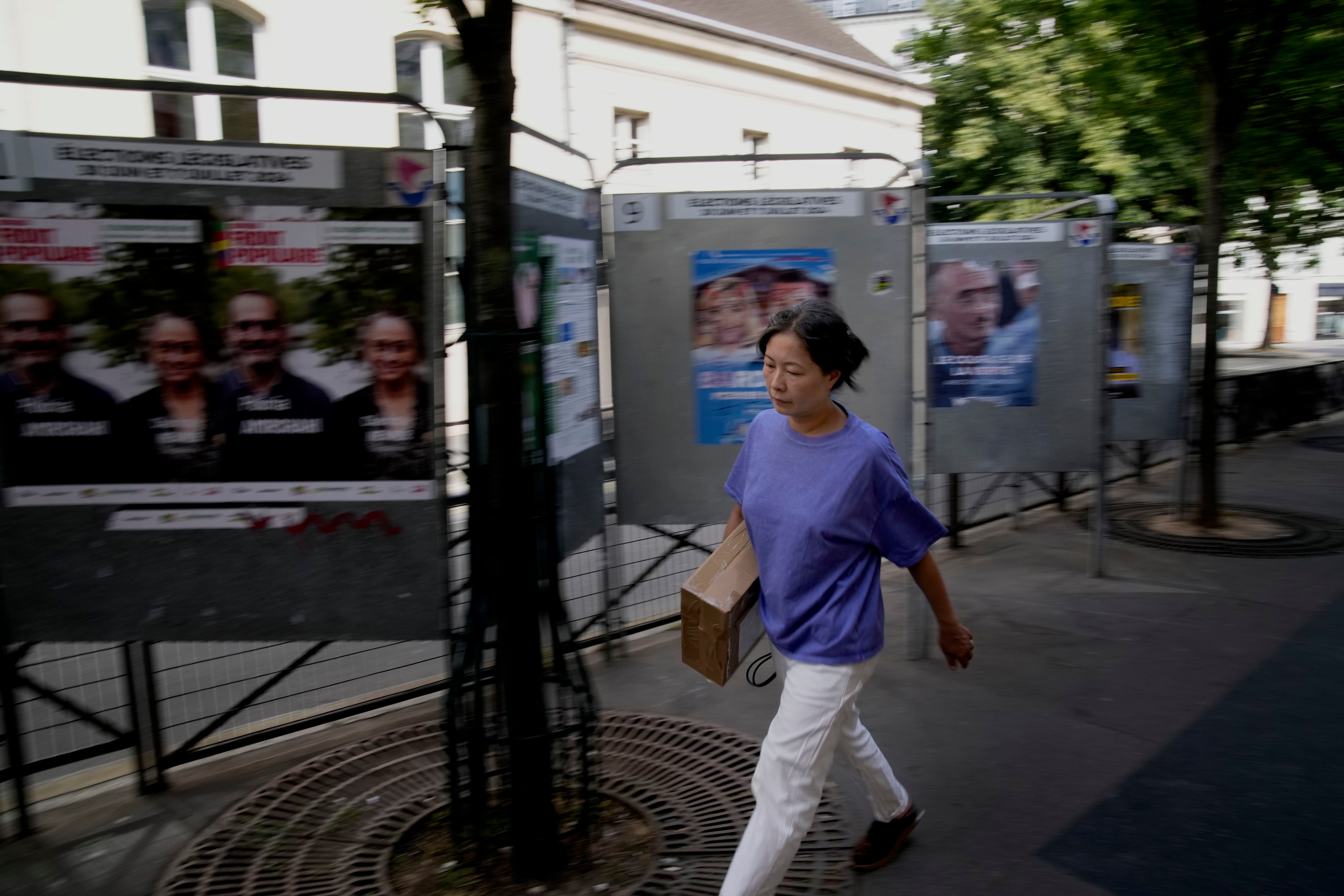 The Latest | Polls are open in France's early legislative election thumbnail