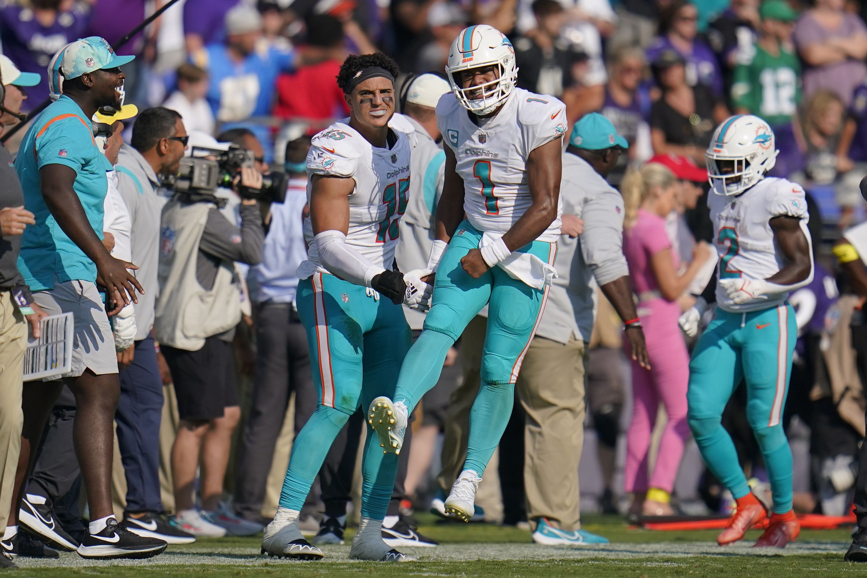 Sunday's NFL: Dolphins halt Allen, survive 'butt punt' to beat Bills