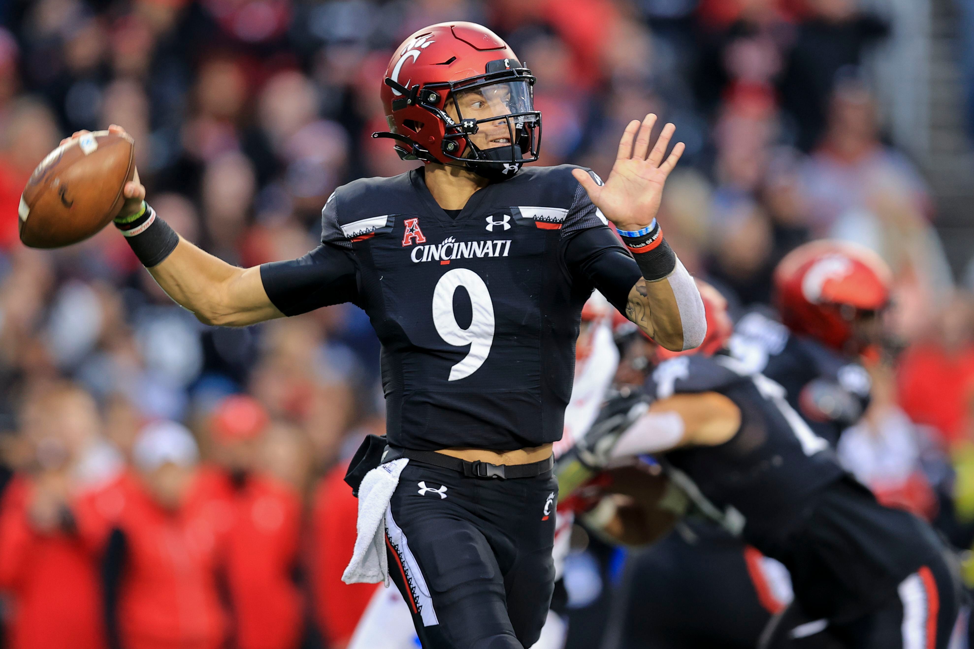 Ridder runs, passes No. 19 Cincinnati past No. 16 SMU, 42-13