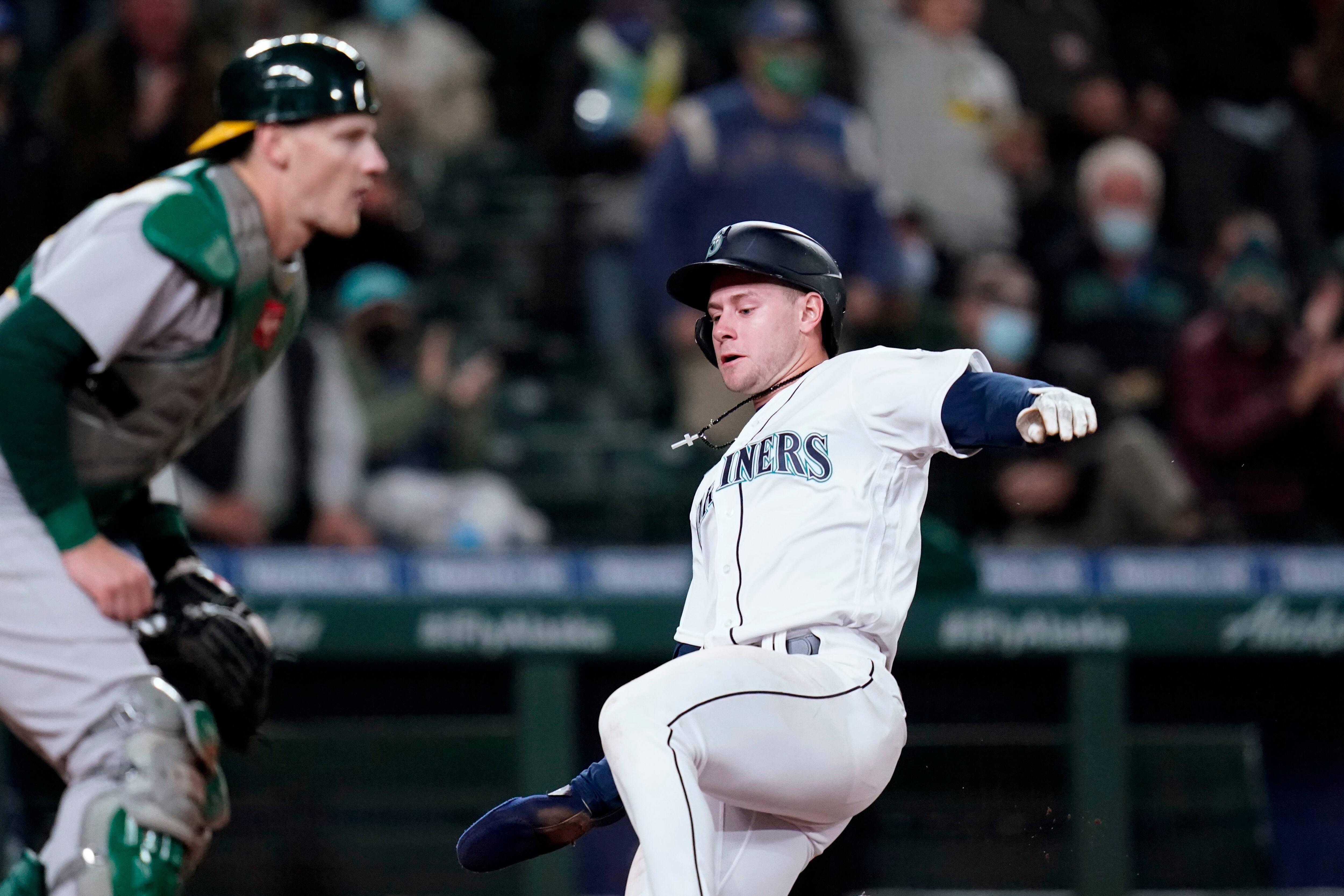 Haniger hits 2 HRs, M's beat A's to gain in wild-card race