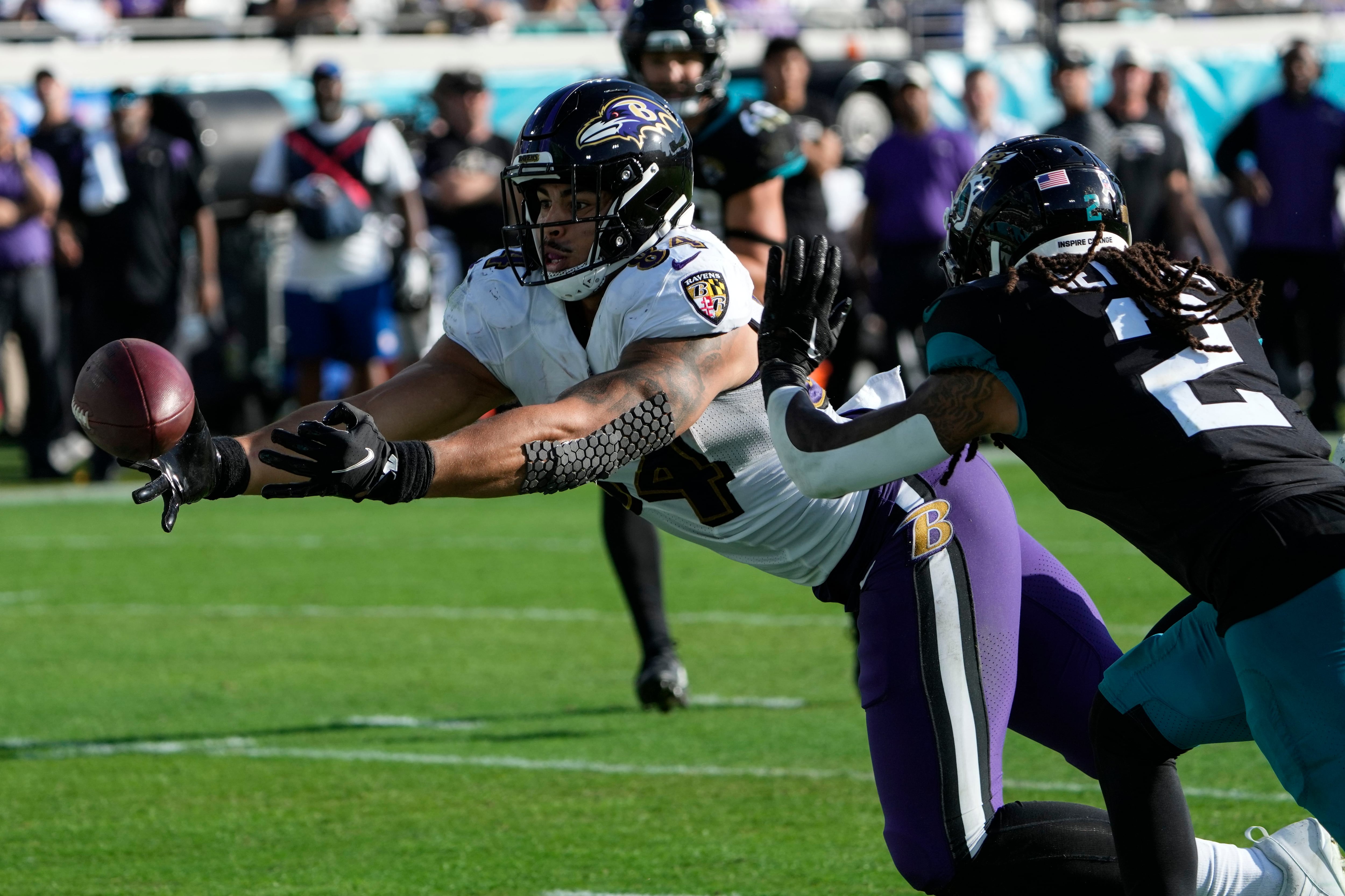 Jacksonville Jaguars safety Andre Cisco (5) breaks up a pass intended for  Baltimore Ravens tight end Mark Andrews (89) during the second half of an  NFL football game, Sunday, Nov. 27, 2022