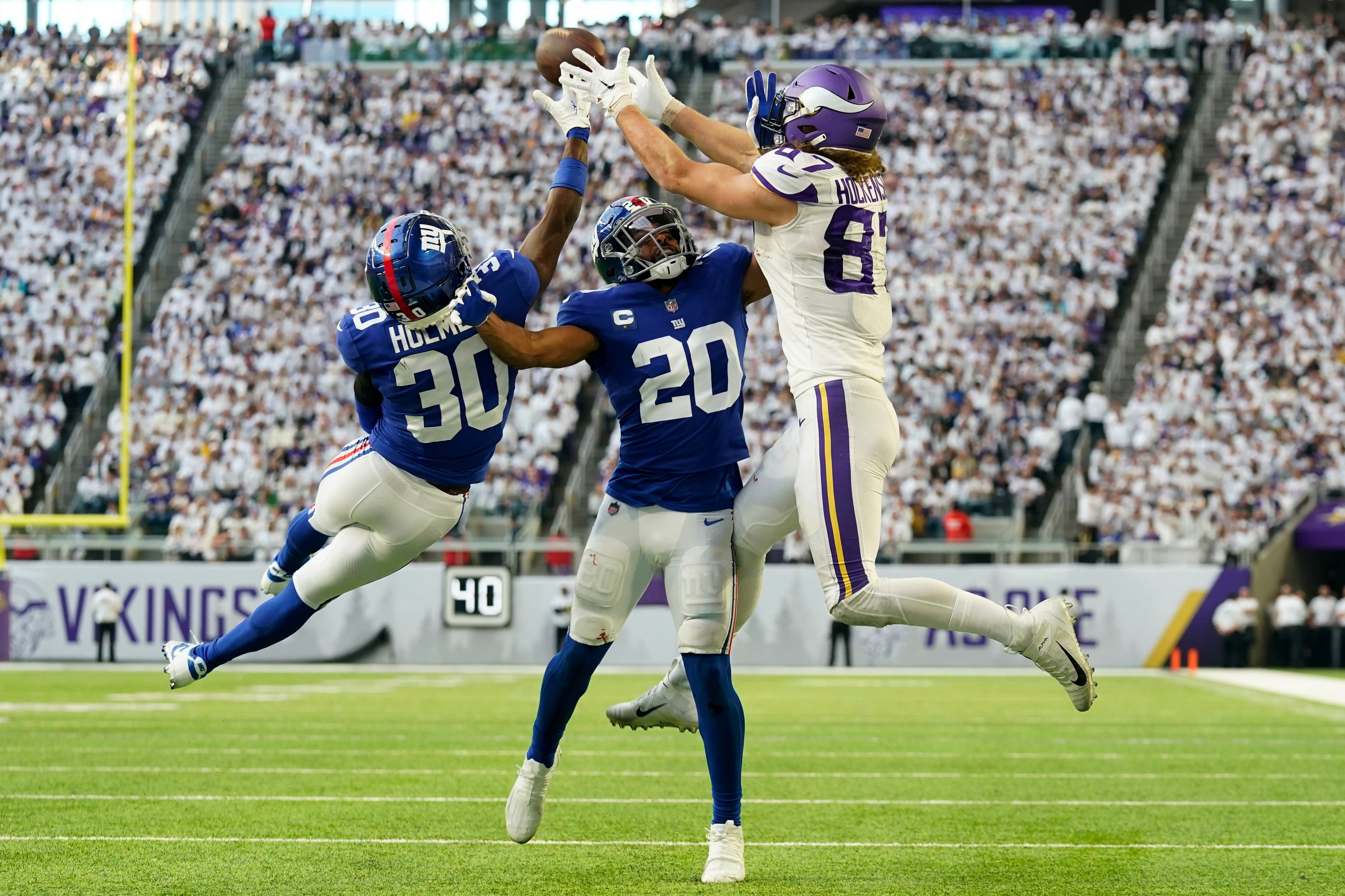 Minnesota Vikings tight end T.J. Hockenson (87) on the field with teammates  during the first half of an NFL football game against the New England  Patriots, Thursday, Nov. 24, 2022 in Minneapolis. (