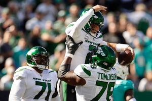 East Rutherford, New Jersey, USA. 9th Oct, 2022. Miami Dolphins quarterback Teddy  Bridgewater (5) is tackled by New York Jets cornerback Sauce Gardner (1) in  the end zone and called for a