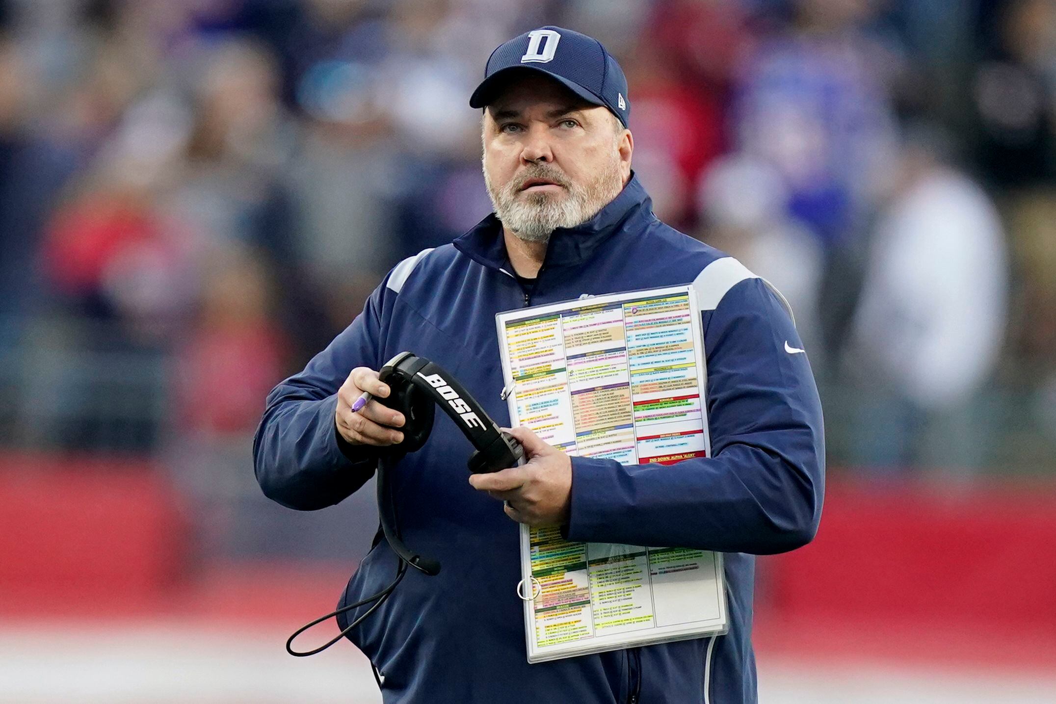 A member of the New England Patriots wears a sweatshirt with the crucial  catch logo during overtime of an NFL football game against the Dallas  Cowboys, Sunday, Oct. 17, 2021, in Foxborough