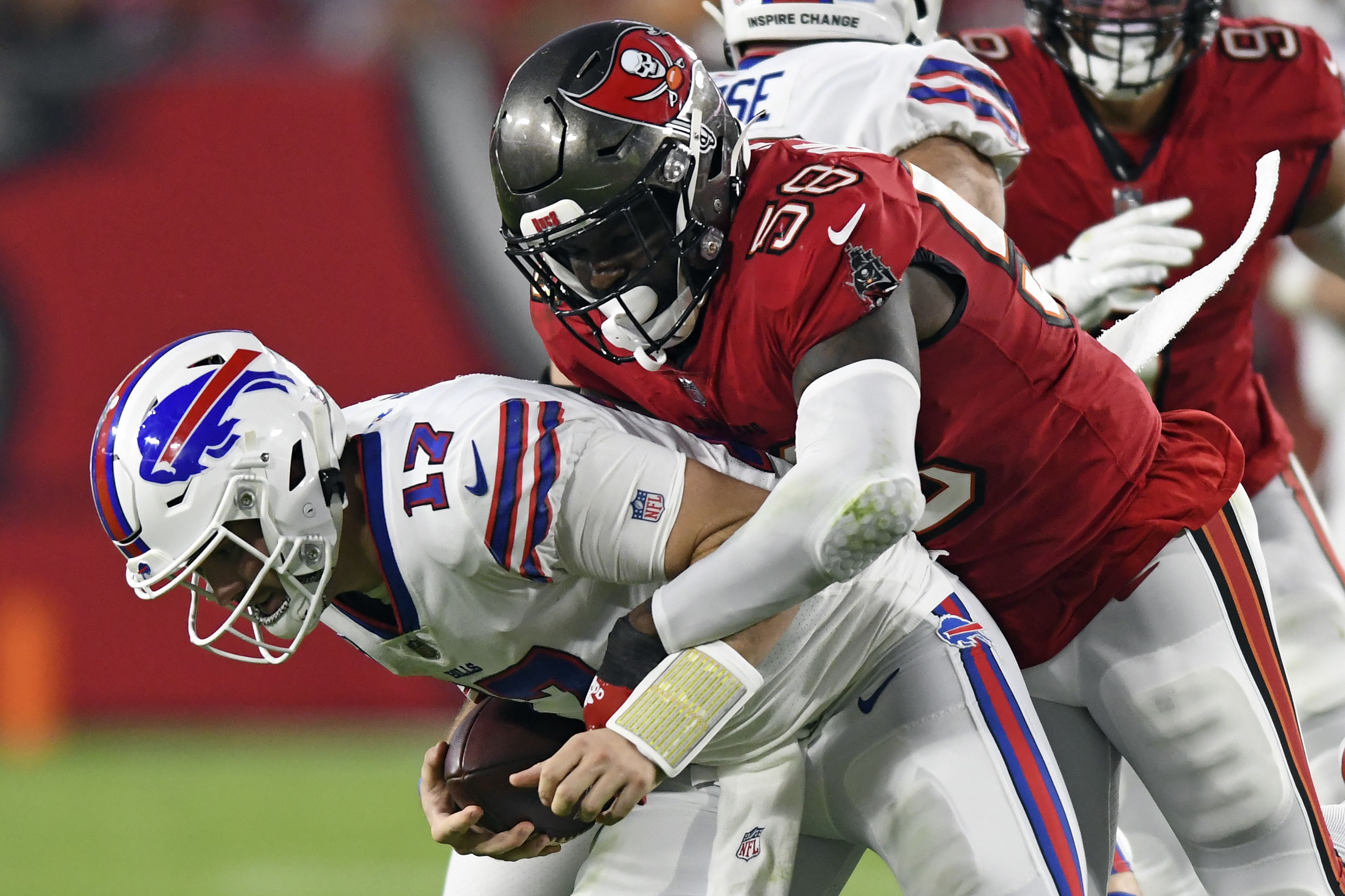 Dallas Cowboys cornerback Anthony Brown (3) stops Tampa Bay Buccaneers  running back Leonard Fournette (7) after a gain running the ball in the  first half of a NFL football game in Arlington