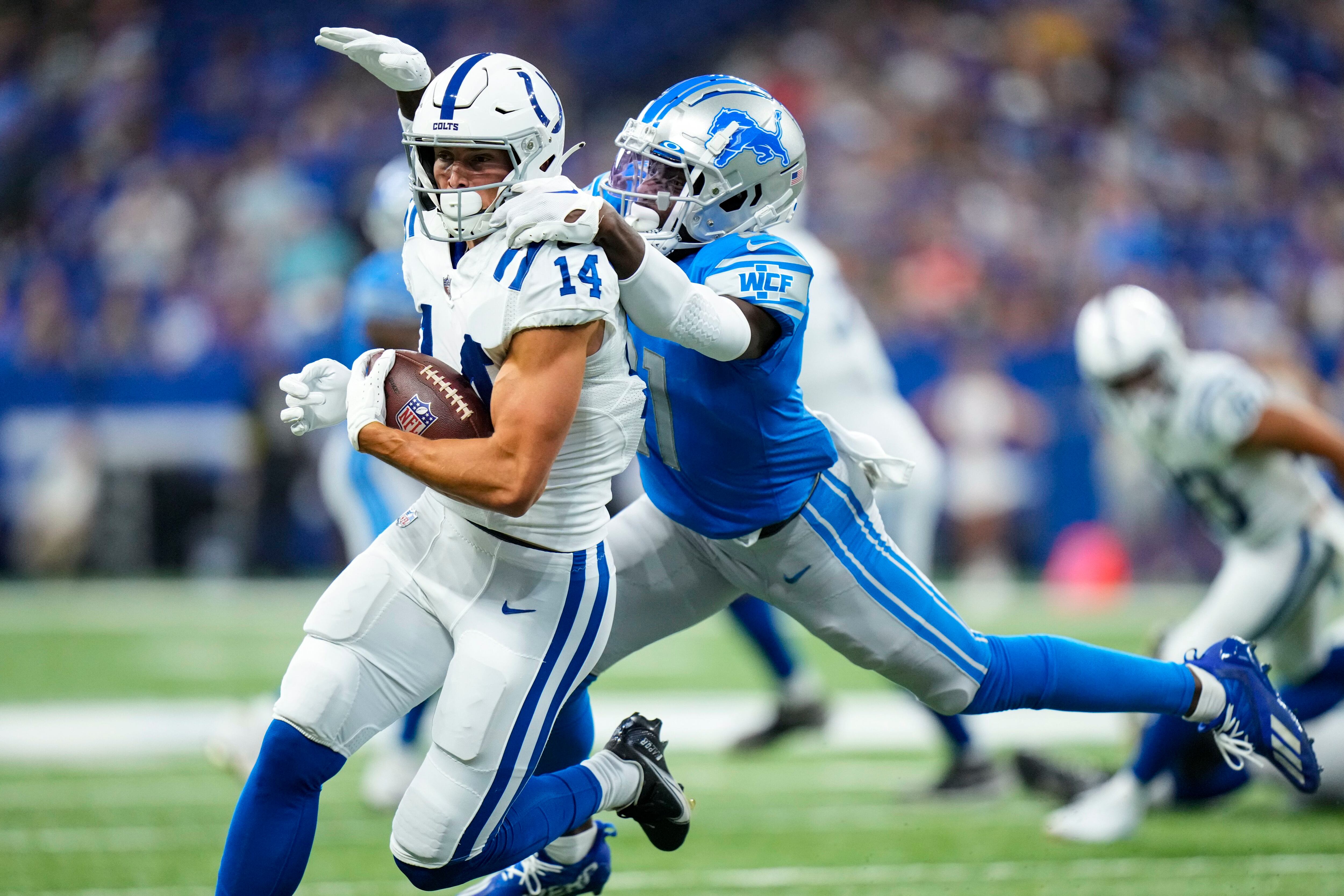 Detroit Lions wide receiver Tom Kennedy (85) makes a catch for a touchdown  over Indianapolis Colts cornerback Tony Brown (38) during first half of an NFL  preseason football game in Indianapolis, Saturday