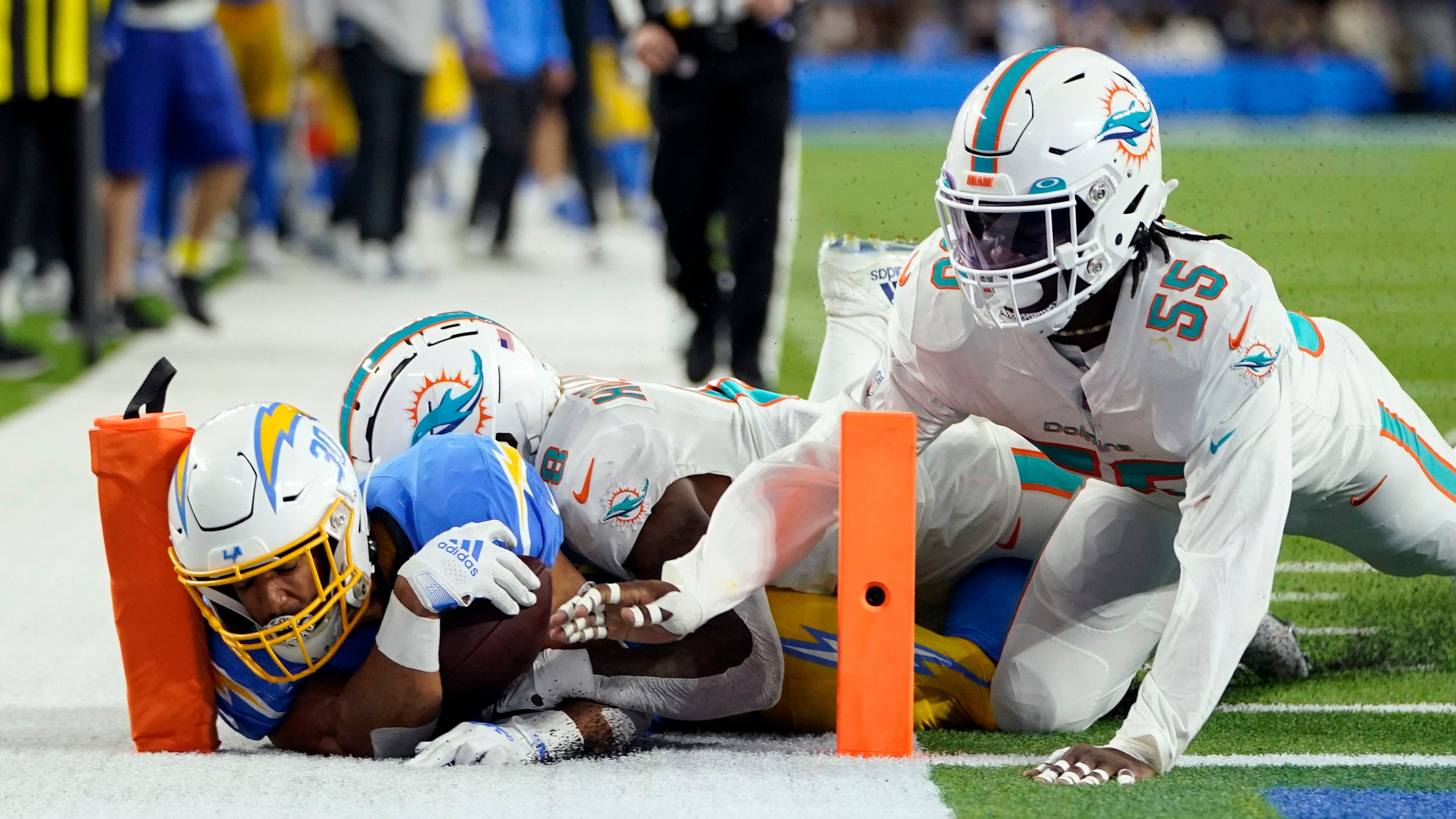 Short-handed Chargers get emotionally charged to beat Dolphins