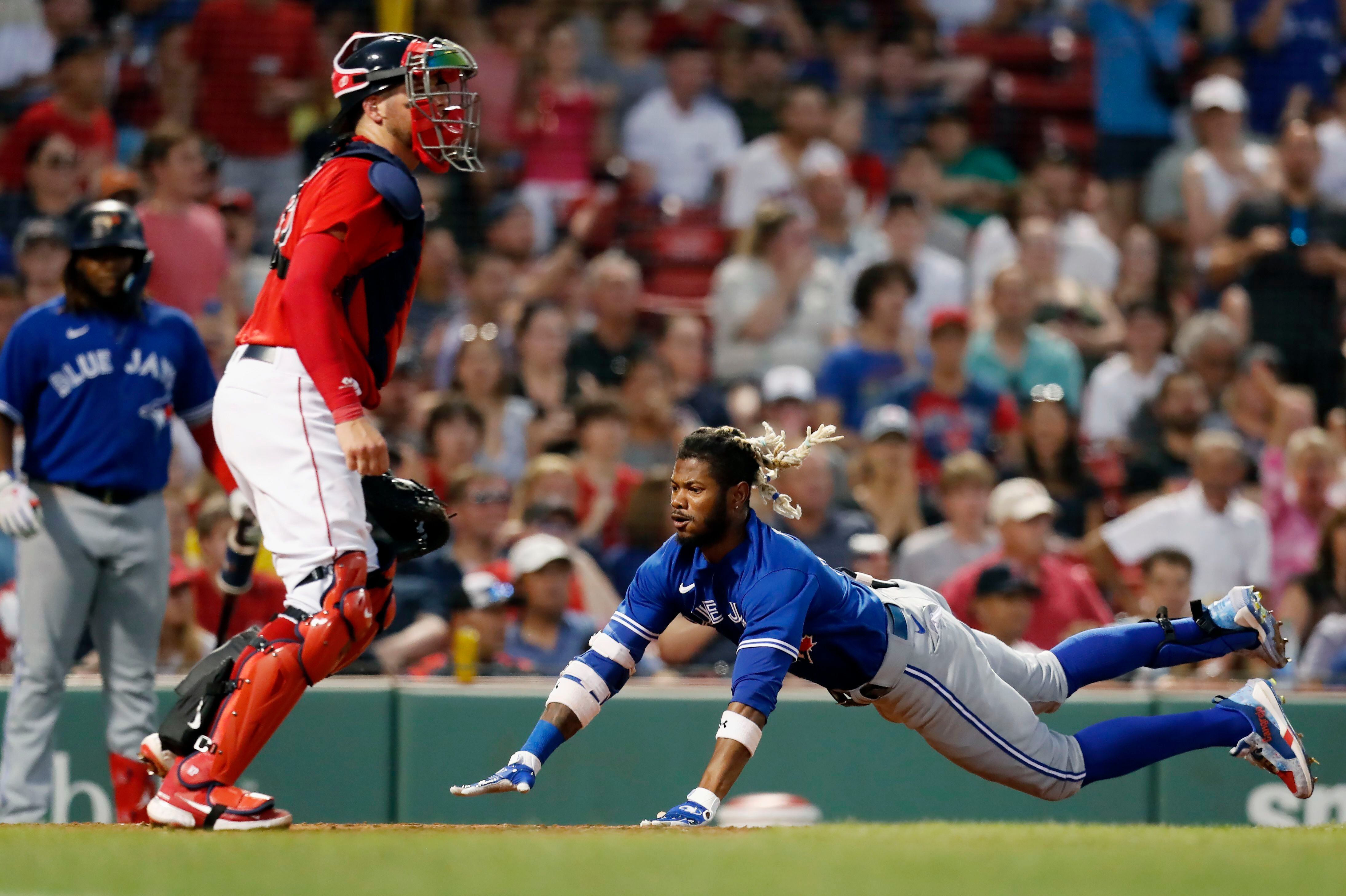 ATLANTA, GA – MAY 10: Boston relief pitcher Kenley Jansen (74) is  congratulated by teammate Raimel Tapia (17) following the conclusion of the  MLB game between the Boston Red Sox and the