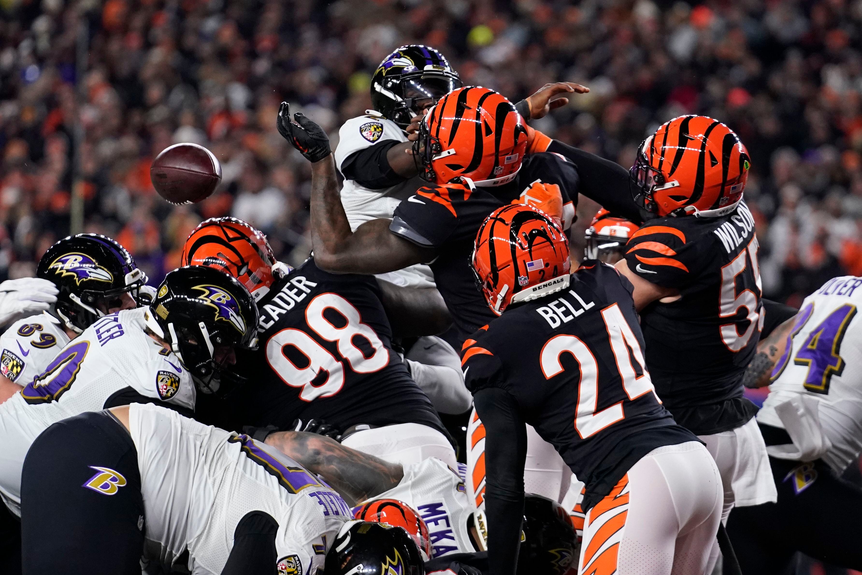 Cincinnati, United States. 16th Jan, 2023. Cincinnati Bengals quarterback  Joe Burrow (9) and Sam Hubbard (94) celebrate after defeating the Baltimore  Ravens 24-17 in their AFC Wild Card game at Paycor Stadium