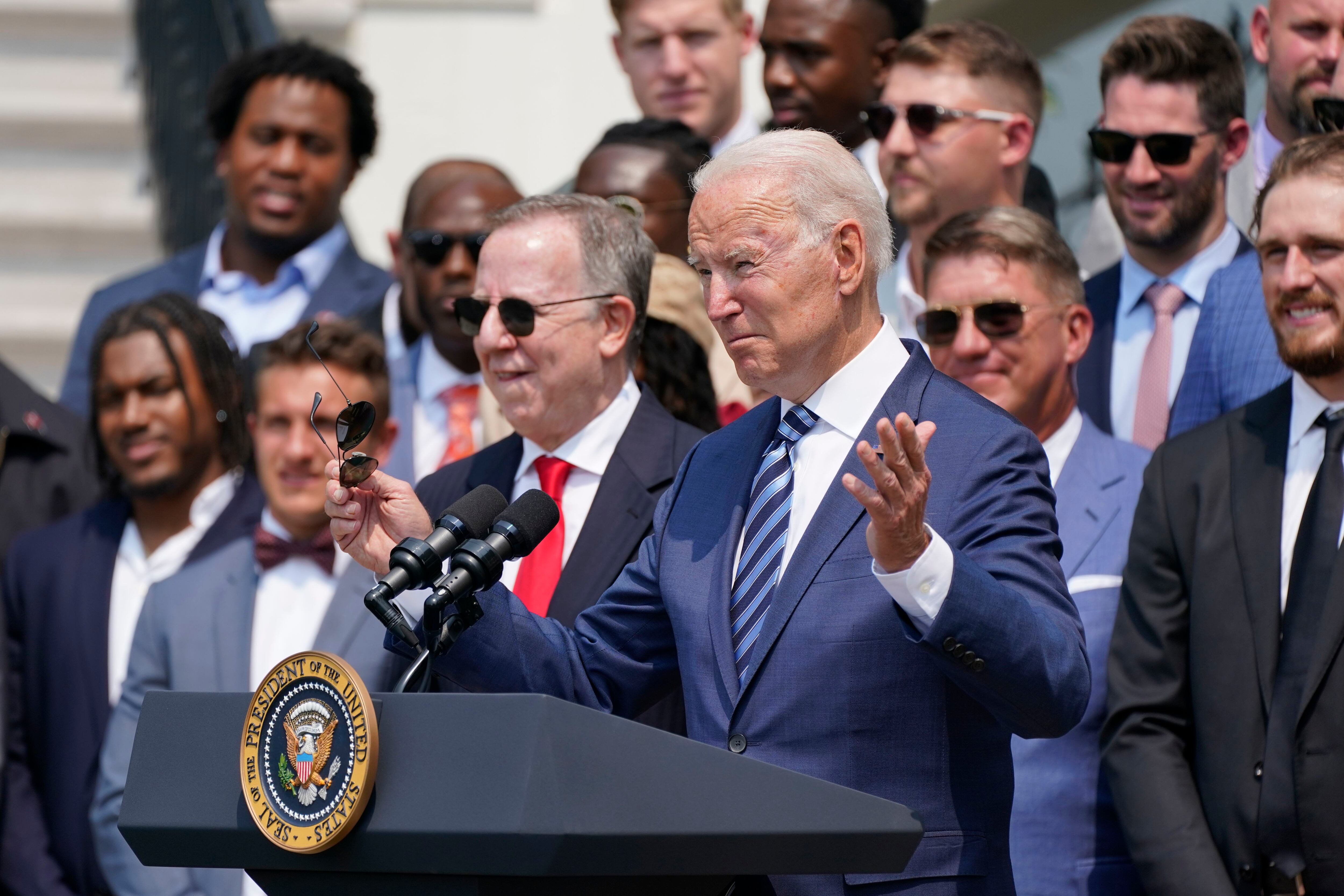 Washington, United States. 20th July, 2021. U.S. President Joe Biden, holds  a number 46 jersey handed to him by Super Bowl Champions Tampa Bay  Buccaneers owner Bryan Glazer, on the South Lawn